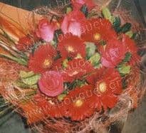 Bouquet of red roses and red gerberas