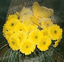 Bouquet of yellow gerberas with a butterfly