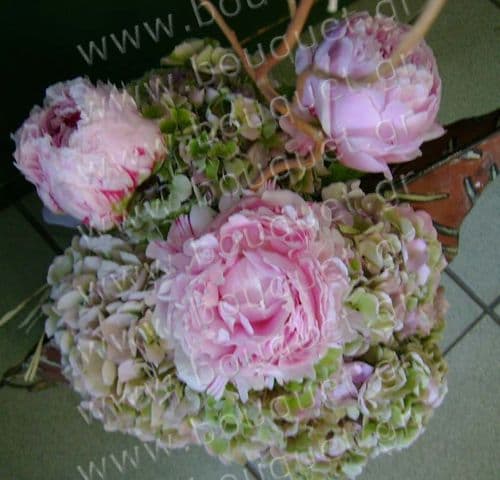 Peonies and hydrangeas in a metal pot